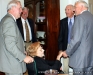 Julia Martin and her son in-law, Joe Filippo (gold tie), speak with Riley and Alex Darnell.