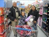Officer Booker Dailey helping a young shopper. (Photo by CPD-Jim Knoll)