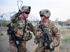 U.S. Army 1st Lt. Andrews Kearns, left, a platoon leader for the 2nd platoon, Whiskey Company, 2nd Battalion, 506th Infantry Regiment provides direction to Pvt. 1st Class Bryce Mickelson during a mass casualty exercise at Forward Operating Base Salerno, Khost province, Afghanistan, Aug. 6, 2013. (U.S. Army photo by Maj. Kamil Sztalkoper/Released)