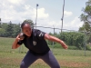 Sgt. Kadina Baldwin heaves a heavy shot put ball July 1, 2014 at Fort Campbell?s Fryar Stadium, demonstrating the winning technique she used during the Army Warrior Games trials June 15-20 at the U.S. Military Academy, West Point, New York. Baldwin took the bronze medal in shot put and gold medals in wheelchair basketball and sitting volleyball.  (U.S. Army photo by Stacy Rzepka/RELEASED)