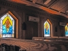Stained glass windows that were hand-painted by a team of chaplain’s assistants are now on display at the chapel on Forward Operating Base Salerno, Afghanistan. A team of chaplain’s assistants teamed up together to finish the restoration of their chapel after it was badly damaged by an attack on the FOB in the summer of 2012. (U.S. Army photo by Sgt. 1st Class Abram Pinnington, TF 3/101 Public Affairs)