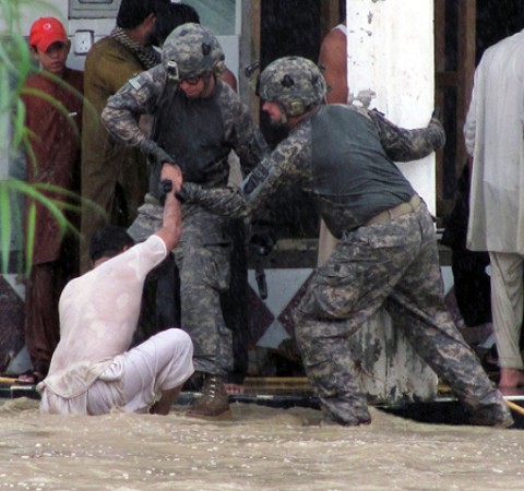 U.S. Army Sgt. 1st Class Patrick Stoner, of Latrobe, PA.,and U.S. Army Sgt. Robert Huff, of Erlanger, Ky., with the Military Police Platoon, Headquarters and Headquarters Company, Special Troops Battalion, Task Force Spartan, rescue an Afghan man from encroaching flood waters in the Nari Shahi village, Beshood District of eastern Afghanistan’s Nangarhar province July 28th. (U.S. Army courtesy photo)