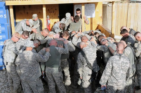 Soldiers of 1st Plt., 287th Engineer Co. pray before leaving on a route clearance mission in southeastern Afghanistan July 18th. Since their arrival in theater in May, Mississippi Army National Guardsmen of the 287th Engineer Co. have been searching for roadside bombs in southeastern Afghanistan. (Photo by U.S. Army Sgt. Spencer Case, 304th Public Affairs Detachment)