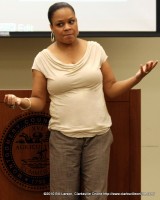 Valerie Guzman addressing the assembled crowd at H.O.P.E.'s 2010 Women's Day Conference