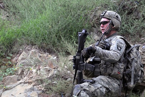 U.S. Army 1st Sgt. Kenneth L. Bolin of Cincinnati, OH, the first sergeant for Company A, 2nd Battalion, 327th Infantry Regiment, Task Force No Slack, directs fire against the enemy during an Aug. 18th attack against troops visiting the village of Spinkay in eastern Afghanistan’s Kunar Province. (Photo by U.S. Army Staff Sgt. Gary A. Witte, 300th Mobile Public Affairs Detachment)