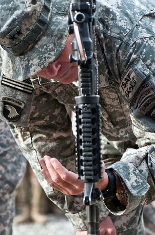 U.S. Army Maj. Gen. John F. Campbell, commanding general of Combined Joint Task Force-101 and Regional Command-East, takes a final moment to thank one of the six fallen Soldiers from Abu Company, 1st Battalion, 327th Infantry Regiment (Task Force Bulldog), 1st Brigade Combat Team, 101st Airborne Division, at Combat Outpost Honikker Miracle in eastern Afghanistan’s Kunar Province Nov. 21st. (Photo by U.S. Army Staff Sgt. Mark Burrell, Task Force Bastogne Public Affairs)