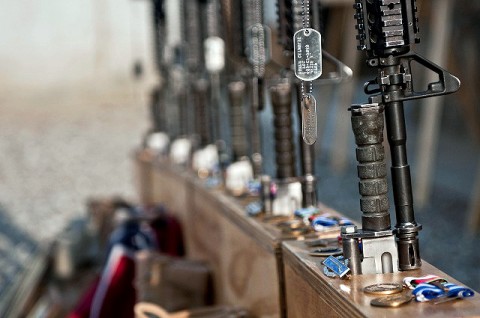 M4 rifles and final awards are displayed during a memorial service for six fallen Soldiers assigned to Abu Company, 1st Battalion, 327th Infantry Regiment (Task Force Bulldog), 1st Brigade Combat Team, 101st Airborne Division, at Combat Outpost Honikker Miracle in eastern Afghanistan’s Kunar Province Nov. 21st. (Photo by U.S. Army Staff Sgt. Mark Burrell, Task Force Bastogne Public Affairs)