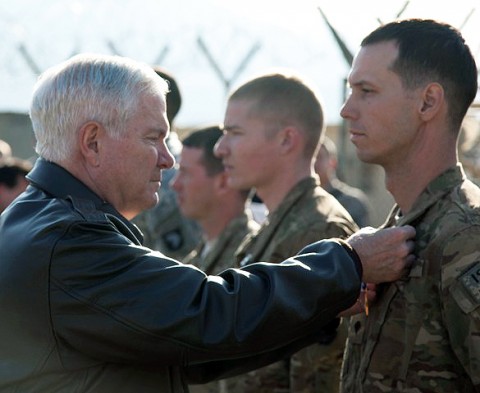 U.S Army Spc. Richard T. Bennett of St. Charles, IL, 1st Battalion, 327th Infantry Regiment, 1st Brigade Combat Team, 101st Airborne Division, is awarded the Silver Star Medal by the Secretary of Defense Robert Gates at Forward Operating Base Joyce Dec. 7th. Bennett was awarded Silver Star for valorous actions against armed and heavily fortified enemies during Operation Strong Eagle. (Photo by U.S. Army Spc. Andy Barrera/Released)