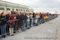 Family Members awaiting the plane stand outside on the tarmac