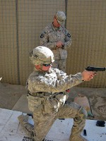 U.S. Army Sgt. Kent Uhler from Scottsburg, IN, with Forward Support Company, 3rd Battalion, 187th Infantry Regiment, takes his turn at the 9 mm pistol competition. (Photo by U.S. Army 1st Lt R.J. Peek, Task Force Rakkasan)