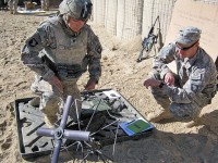 U.S. Army Spc. John Davis from Bettendorf, Iowa, with Company B, 3rd Battalion, 187th Infantry Regiment, successfully sets up the tactical satellite system for in the field communication. (Photo by U.S. Army 1st Lt R.J. Peek, Task Force Rakkasan)