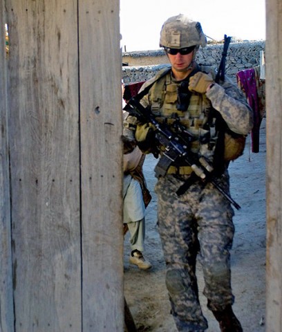 U.S. Army Staff Sgt. Joseph Schaffner, a squad leader with 2nd Platoon, Company B, 1st Battalion, 187th Infantry Regiment, a native of Camby, OR, exits a compound after squad members and Afghan National Security Forces complete a search for contraband, in Zambar, Afghanistan, Jan. 18th. (Photo by U.S. Army Staff Sgt. Andrew Guffey, Task Force Rakkasan Public Affairs Office)