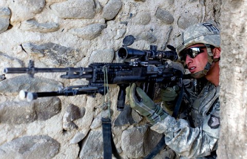 U.S. Army Spc. Kyle Oszczakiewicz, an infantryman with 2nd Platoon, Company B, 1st Battalion, 187th Infantry Regiment, a native of Trenton, NJ, scans for an insurgent as 2nd Plt. receives small arms fire from across a wadi in Zambar, Afghanistan, Jan. 18th. (Photo by U.S. Army Staff Sgt. Andrew Guffey, Task Force Rakkasan Public Affairs Office)