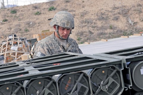 Spc. Frank Barnes, an ammunition specialist for the 592nd Ordnance Company, a reserve unit from Billings, Mont., attached to the 142nd Combat Sustainment Support Battlalion, 101st Sustainment Brigade, inspects an Air Force pallet with ordnance preparing for an air delivery to outlying forward operating bases. All ammunition destined for FOBs in Northern, Central and Eastern Afghanistan passes through the 592nd. (Photo by Spc. Michael Vanpool)