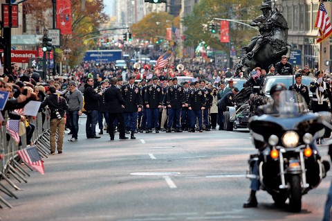 Green Berets from the 5th Special Forces Group (Airborne) walk alongside the newly dedicated De Oppresso Liber statue as it made its way down 5th Avenue as part of the New York City Veterans Day Parade, Nov. 11th, 2011. (Photo courtesy of Spec. Kerry Otjen)