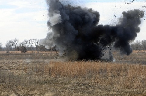 Soldiers of the 1st Brigade Combat Team, 101st Airborne Division, detonate a bangelore torpedo to destroy concertina wire during a training scenario here at the range Dec. 9th. (Photo by Sgt. Richard Daniels Jr.)