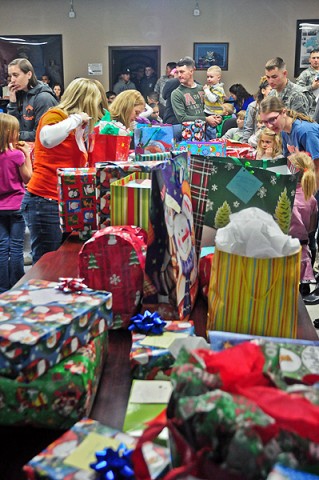 The Soldiers and family members of Company B, 1st Battalion, 502nd Infantry Regiment, 2nd Brigade Combat Team, 101st Airborne Division (Air Assault), the Bulldog Family Readiness Group and the Occupational Therapy Group from Milligan College hand out presents to the children of the unit and handed out an array of presents at Strike Academy Dec. 15th. (U.S. Army photo by Sgt. Joe Padula, 2nd BCT PAO, 101st Abn. Div.)