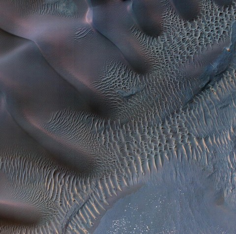 This enhanced-color image shows sand dunes trapped in an impact crater in Noachis Terra, Mars. (Image credit: NASA/JPL-Caltech/Univ. of Arizona)