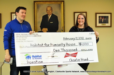 J.R Hand presents City Councilwoman Deanna McLaughlin a $1,000 check for Habitat for Humanity Women Build 2012 Thursday afternoon.