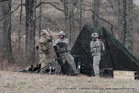 Colonel Daniel R. Walrath, the Commander of the 2nd Brigade Combat Team takes a turn firing the 120mm mortar