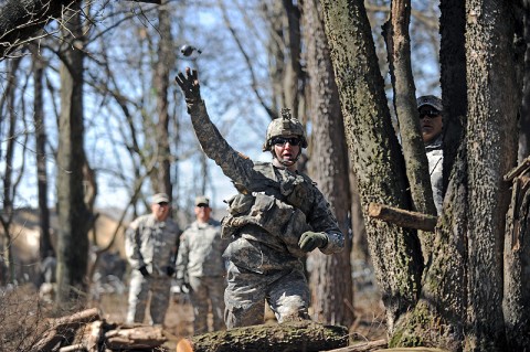 U.S. Army 1st Lt. Andrew D. Sivanich, the executive officer for Company E, 2nd Battalion, 506th Infantry Regiment, 4th Brigade Combat Team, 101st Airborne Division, throws a hand grenade during the Patrol Lane portion of the Expert Infantryman Badge testing, March 5th, 2012, at Fort Campbell, Ky. The Patrol Lane of the Expert Infantryman Badge testing consists of 10 tasks and one decision task that candidates must navigate during the event. (Photo by Staff Sgt. Todd Christopherson)