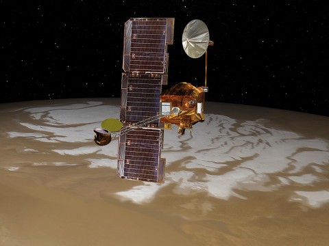 NASA's Mars Odyssey spacecraft passes above Mars' south pole in this artist's concept illustration. The spacecraft has been orbiting Mars since October 24th, 2001. (Image credit: NASA/JPL)