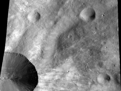 This image from NASA's Dawn spacecraft shows a close up of part of the rim around the crater Canuleia on the giant asteroid Vesta. Canuleia, about 6 miles (10 kilometers) in diameter, is the large crater at the bottom-left of this image. (Image credit: NASA/JPL-Caltech/UCLA/MPS/DLR/PSI/Brown)