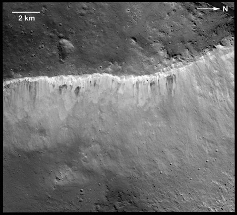 The interplay of bright and dark material at the rim of Marcia crater on Vesta is visible in this image mosaic taken by NASA's Dawn spacecraft. The brightness variation at Vesta is now known to be among the most extreme of the rocky bodies in the solar system. Scientists believe the bright material is uncontaminated by dark material and is native to Vesta. (Image Credit: NASA/JPL-Caltech/UCLA/MPS/DLR/IDA/LPI/ASU)