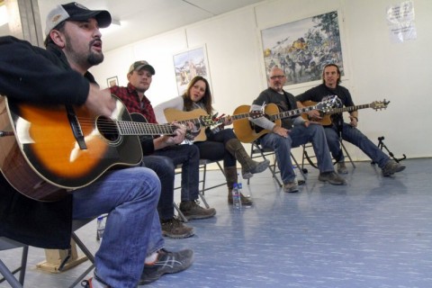 Carlton Ray Scott (near), plays a song as other members of the Nashville to You Tour look on at Forward Operating Base Gardez, Nov. 15, 2012. Other members of the tour include (after Scott, from left to right) Thomas Verges, Hillary Lindsey, Billy Montana and Keni Thomas. The tour featured Nashville's top songwriters and performers as they traveled throughout Afghanistan performing for deployed soldiers. (U.S. Army Photo by Sgt. 1st Class Abram Pinnington, TF 3/101 PAO)