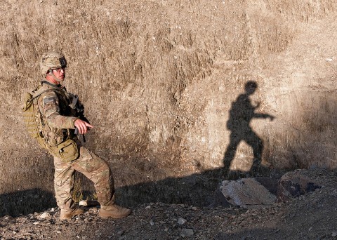 U.S. Army Spc. Erik Nantz, a medic attached to Blue Platoon, Troop B, 1st Squadron, 33rd Calvary Regiment, 3rd Brigade Combat Team, 101st Airborne Division (Air Assault), points out a possible weapons cache location in Shamal District, Oct. 26, 2012. Troop B conducted route reconnaissance and looked for weapons caches and improvised explosive devices. (U.S Army photo by Sgt. Christopher Bonebrake, 115th Mobile Public Affairs Detachment)