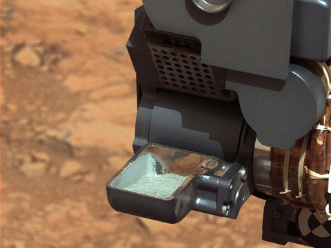 This image from NASA's Curiosity rover shows the first sample of powdered rock extracted by the rover's drill. (Image credit: NASA/JPL-Caltech/MSSS)