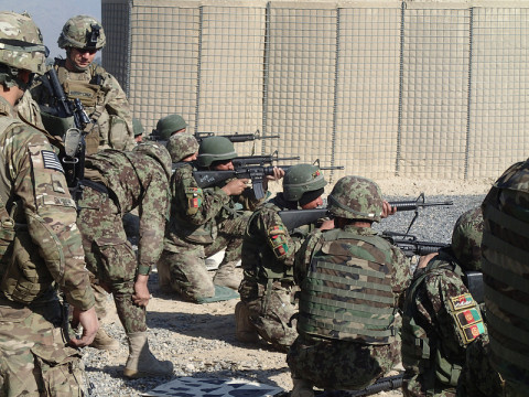 Members of Archangel Security Force Advisory and Assistance Team, 1st Squadron, 32nd Cavalry Regiment, 1st Brigade Combat Team, 101st Airborne Division look on as NCOs from 2nd Kandak, 4th BDE, 201st ANA Corps execute qualification on the M16 rifle on Shinwar Base in Nangahar Province. (Sgt. Connor Quinn/U.S. Army)