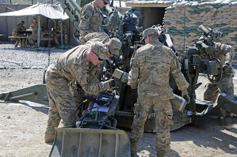 U.S. Army Soldiers with Battery A, 2nd Battalion, 320th Field Artillery, 1st Brigade Combat Team, 101st Airborne Division, practice using the Enhanced Portable Inductive Artillery Fuse Setter on a XM1156 Precision Guidance Kit Fuse and the M795 Rocket-Assisted Projectile April 28, 2013 at Forward Operating Base Joyce, Kunar Province, Afghanistan. (U.S. Army photo by Sgt. Jon Heinrich, CT 1-101 Public Affairs)