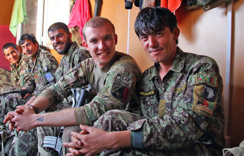 Sgt. Erik Choquette, Security Force Advise and Assist Team medical advisor with the 162nd Infantry Brigade, attached to 2nd Battalion, 506th Infantry Regiment, 4th Brigade Combat Team, 101st Airborne Division, hangs out with Afghan National Army Soldiers in their living quarters during a visit to an ANA combat outpost outside of Shur Kalay, Afghanistan, on May 25, 2013. (U.S. Army photo by Sgt. Justin Moeller, 4th Brigade Combat Team Public Affairs)
