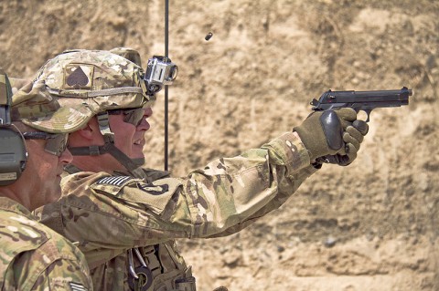 U.S. Army Spc. Sean C. Poole, an infantryman with 2nd Battalion, 506th Infantry Regiment, 4th Brigade Combat Team “Currahee”, 101st Airborne Division (Air Assault), fires an M9 at a target while competing for Soldier of the Quarter at forward operating base Salerno, Afghanistan, July 14, 2013. (U.S. Army photo by Sgt. Justin A. Moeller, 4th Brigade Combat Team Public Affairs)