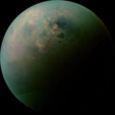 This false-color mosaic, made from infrared data collected by NASA's Cassini spacecraft, reveals the differences in the composition of surface materials around hydrocarbon lakes at Titan, Saturn's largest moon. (NASA/JPL-Caltech/University of Arizona/University of Idaho)