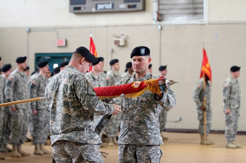 Command Sgt. Maj. Michael Brown, the senior enlisted adviser of the 2nd Battalion, 44th Air Defense Artillery Regiment (left), and Lt. Col. Timothy Shaffer, commander of the 2-44th ADA, case the battalion’s colors Jan. 10 at Fort Campbell, KY. The act symbolizes the unit is ready for deployment and, when 2-44th ADA deploys later this year, it will be the battalion’s sixth deployment since 2003. (U.S. Army photo by Sgt. Leejay Lockhart, 101st Sustainment Brigade Public Affairs)