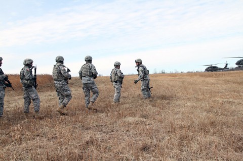 Soldiers from 1st Platoon, 218th Military Police Company, 716th Military Police Battalion, 101st Sustainment Brigade, 101st Airborne Division (Air Assault), prepare for UH-60 Black Hawk helicopters to extract them during an air assault training mission Jan. 27, at Fort Campbell, Ky.  Air assault tactics allows units to get on the objective quickly and surprise the enemy. (Sgt. Leejay Lockhart, 101st Sustainment Brigade Public Affairs)