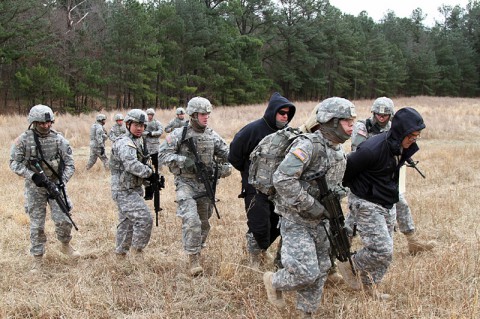 Soldiers from 1st Platoon, 218th Military Police Company, 716th Military Police Battalion, 101st Sustainment Brigade, 101st Airborne Division (Air Assault), escort detainees to a secure area during an air assault training mission Jan. 27, at Fort Campbell, Ky. Searching and interrogating detainees can yield valuable intelligence. (Sgt. Leejay Lockhart, 101st Sustainment Brigade Public Affairs)