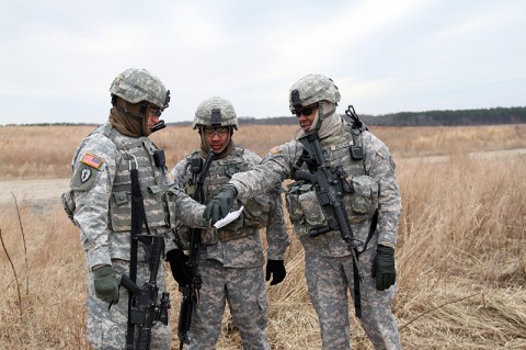 From left, Staff Sgt. Zachary Eierman, Staff Sgt. Nho Nguyen, and Staff Sgt. Rowle Boone, noncommissioned officers from 1st Platoon, 218th Military Police Company, 716th Military Police Battalion, 101st Sustainment Brigade, 101st Airborne Division (Air Assault), plan a rehearsal for detainee operations during an air assault training mission Jan. 27, at Fort Campbell, Ky. The unit trains hard to ensure everybody is proficient at their jobs in any situation. (Sgt. Leejay Lockhart, 101st Sustainment Brigade Public Affairs)