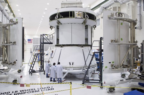 Engineers prepare Orion’s service module for installation of the fairings that will protect it during launch this fall when Orion launches on its first mission. The service module, along with its fairings, is now complete. (NASA)