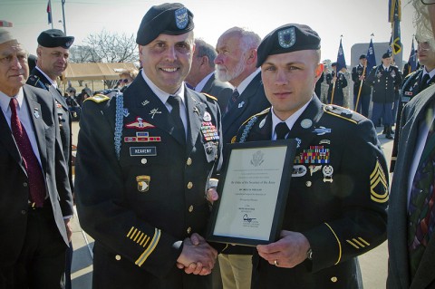 U.S. Army Sgt. 1st Class Billy R. Weiland, a Soldier with 1st Battalion, 506th Infantry Regiment, 4th Brigade Combat Team, 101st Airborne Division (Air Assault), was presented a certificate by Col. Val C. Keavney Jr., commander of the 4th BCT, 101st Abn. Div., formally inducting him as a Distinguished Member of the 506th Infantry Regiment, during a ceremony March 13, 2014. (U.S. Army photo by Sgt. Justin A. Moeller, 4th Brigade Combat Team Public Affairs)