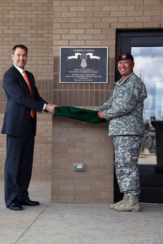 Lieutenant Col. Fred Dela Cruz, commander of the Group Support Battalion, 5th Special Forces Group (Airborne), is joined by Mr. Roque Versace, nephew of Capt. Humberto “Rocky” Versace, following the dedication of the GSB headquarters building in honor of Capt. Versace May 16, 2014, at Fort Campbell, Ky.  (Pvt. 1st Class Robert Venegas)