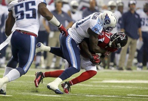 Atlanta Falcons wide receiver Devin Hester (17) gets tackled by Tennessee Titans strong safety Bernard Pollard (31) after a catch in the second quarter of their game at the Georgia Dome. (Jason Getz-USA TODAY Sports)