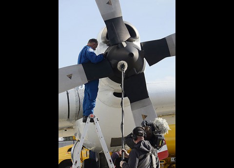 NASA Super Guppy crew member James Isley, performs routine maintenance checks while the plane refueled at Fort Campbell, Dec. 11th. A crew from the television show “Mighty Planes” flew aboard the Super Guppy on its mission from Long Beach, CA, to Langley Research Center in Virginia, to film an hourlong episode on the unique cargo plane. (Megan Locke Simpson | Fort Campbell Courier)