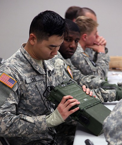 A Soldier from 1st Brigade Combat Team, 101st Airborne Division receives hands-on radio training from 5th Special Forces Group Jan. 12 on Fort Campbell. The training concluded a five-part combined training exercise between the two units. (Spc. Robert Venegas, 5th SFG(A) Combat Camera)