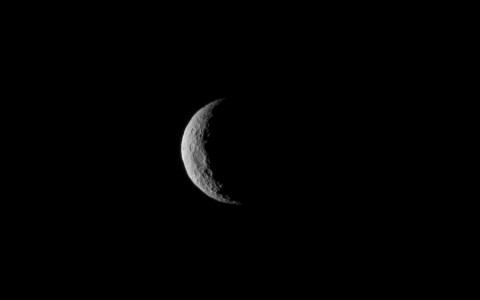 The slim crescent of Ceres smiles back as the dwarf planet awaits the arrival of an emissary from Earth. (NASA)