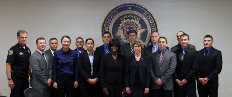 (L to R) Chief Al Ansley, Robert Steinmetz, Ronald Cox, Shandie Owenby, Brandon Diez, Brittany Hubbard, Matthew Roederer, Tryesha Clark, Andrew Henry, Mayor Kim McMillan, Steven Deering, Joshua Clegg, Kevin Westover, Nickolas Nemeth and Joshua Spain.