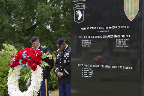 The 716th Military Police Battalion, 101st sustainment Brigade, 101st Airborne Division, bow their heads in a moment of silence for their fallen brothers and sisters at a Memorial Day ceremony at the Don F. Pratt Memorial Museum’s memorial park on Fort Campbell, Ky. May 21, 2015. (Sgt. 1st Class Mary Rose Mittlesteadt, 101st Sustainment Brigade, 101st Airborne Division (Air Assault) Public Affairs)