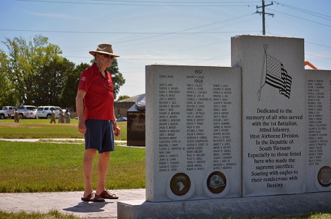 A veteran takes time to read one of the 2nd Brigade Combat Team, 101st Airborne Division (Air Assault) memorials shortly after a rededication ceremony conducted by the “Strike” brigade at Fort Campbell, Ky., during the Day of the Eagles, July 30, 2015. The event moved the memorials to the intersection of Screaming Eagle Blvd. and Tennessee Ave., across from Gear-To-Go. (Staff Sgt. Sierra A. Fown, 2nd Brigade Combat Team, 101st Airborne Division Public Affairs)